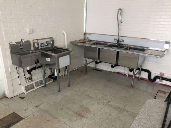 commercial kitchen plumbing setup with multiple sinks installed in spokane garland area