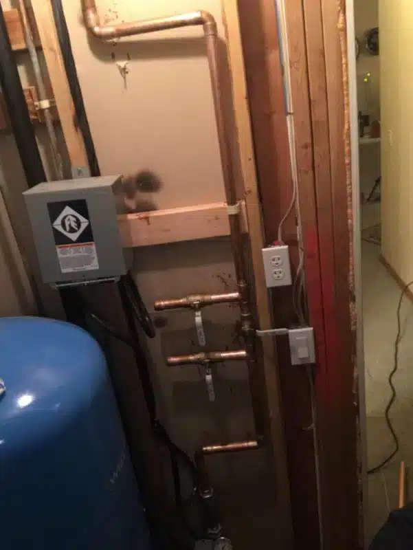 new copper pipe section installed after leak repair