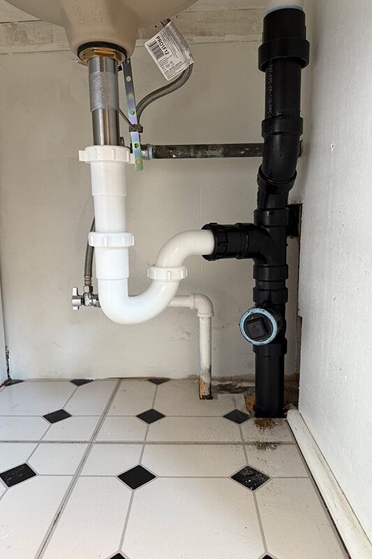 Upgraded under-sink drain system after professional replacement