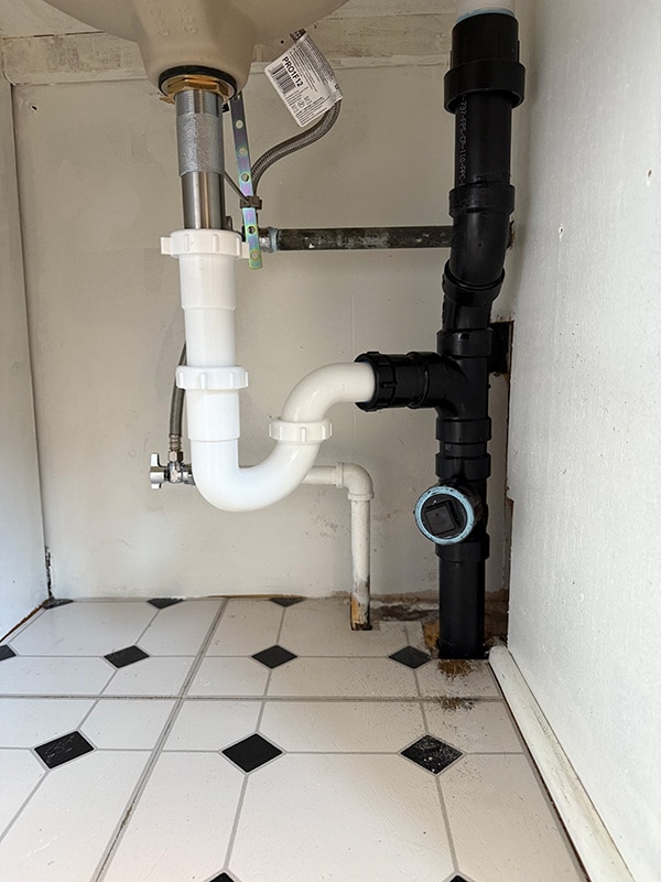 Upgraded under-sink drain system after professional replacement