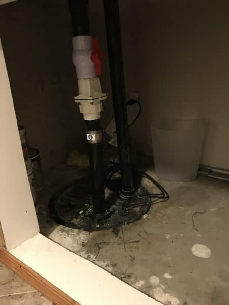 ejector-pump-replacement-system replacement ejector pump setup inside sump basin after installation