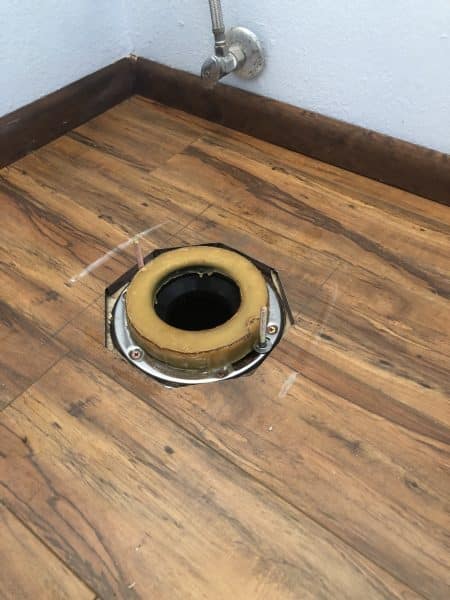 failed-toilet-wax-ring-seal failed wax ring seal under toilet showing incomplete contact at base