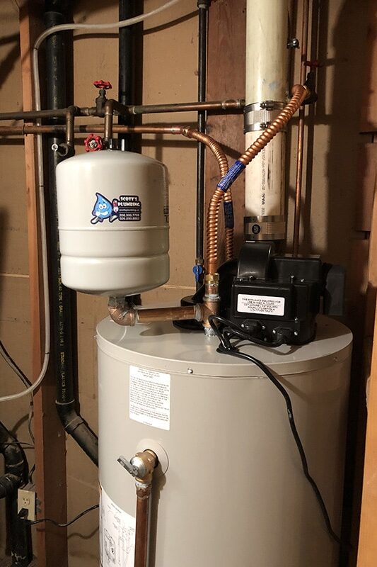 Gas power vent water heater installed with sealed exhaust venting system