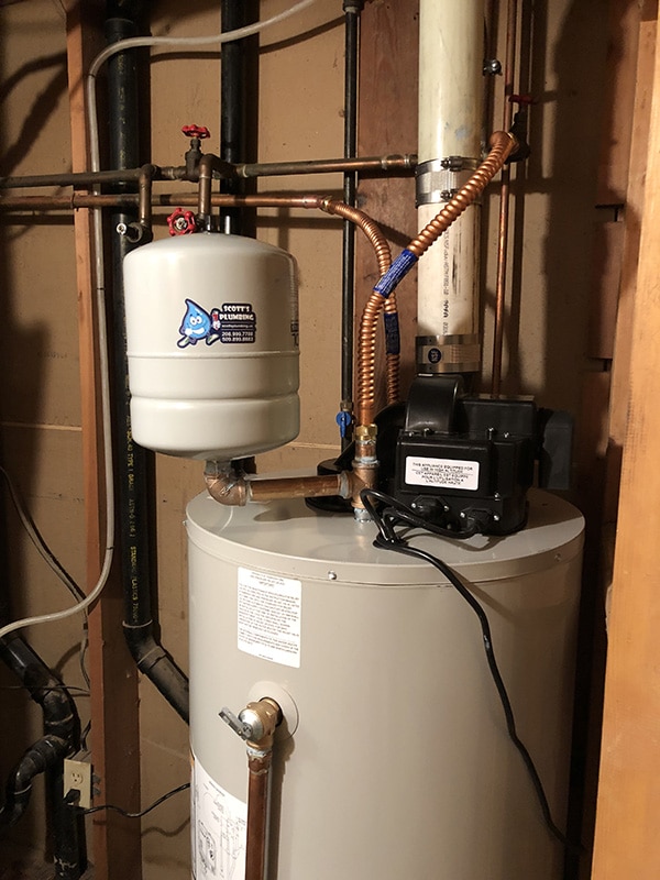 Gas power vent water heater installed with sealed exhaust venting system