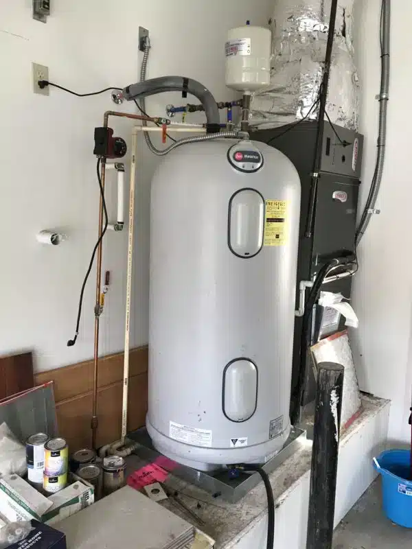 Old residential water heater before replacement Old residential water heater before replacement