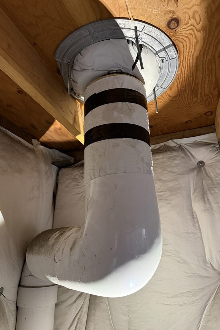 close view of roof drain pipe connection band inspected after leaking