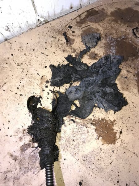 sewer-line-clog-debris-spokane debris removed from clogged sewer line using cable machine in Spokane