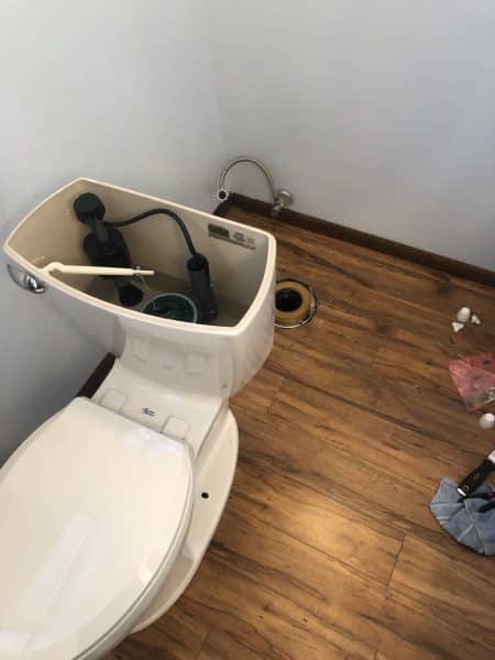 toilet-leak-repair-base-view toilet leaking at base before being reset with new wax ring