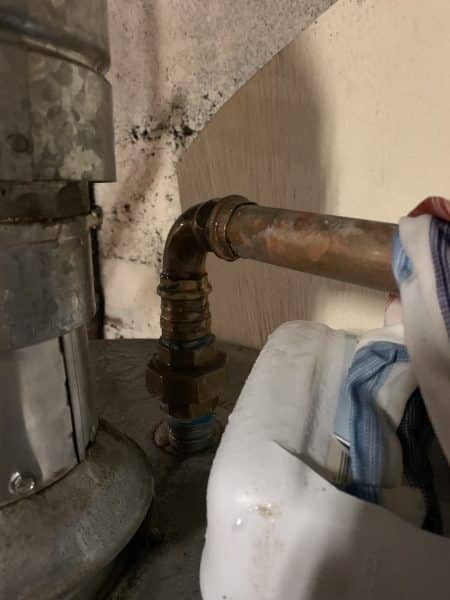 leaking water heater connection repaired with ProPress fitting in apartment building